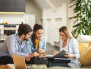 A female agent advising her clients.