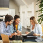 A female agent advising her clients.